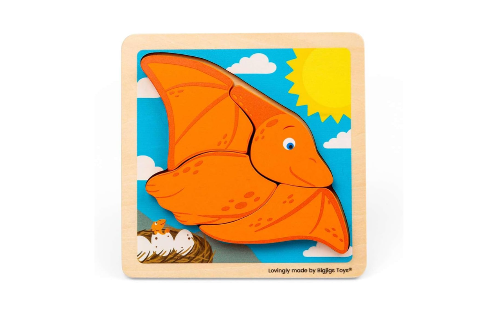 Chunky Lift Out Pterodactyl by Bigjigs with vibrant orange pieces and a sunny sky background