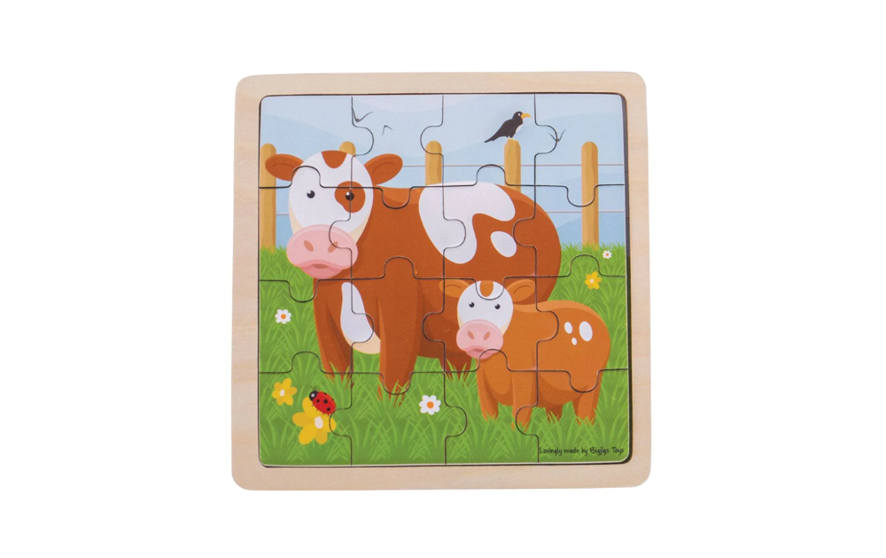 Bigjigs farm animal jigsaw for children featuring colorful cows in a grassy field