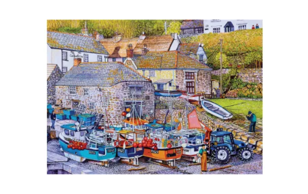 House of Puzzles Cadgwith Cove jigsaw puzzle 500 piece showing colourful fishing boats on a quay with stone cottages and tractor