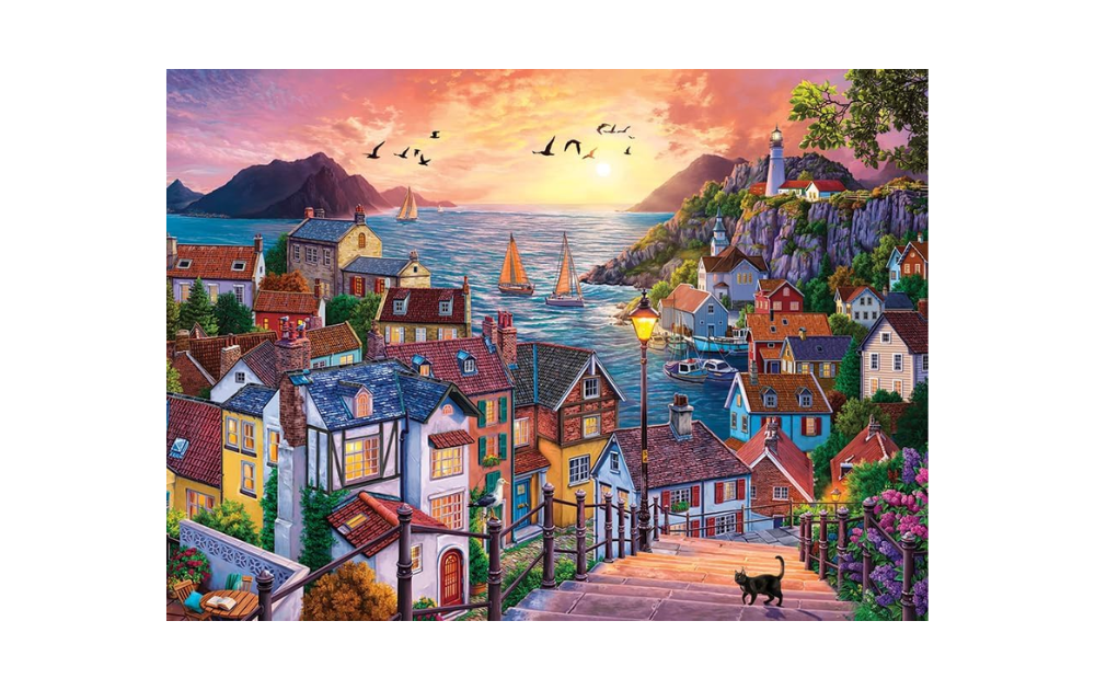 Coastal Town at Sunset 1000 Piece Jigsaw Puzzle by Cobble Hill featuring colourful houses and a scenic sunset