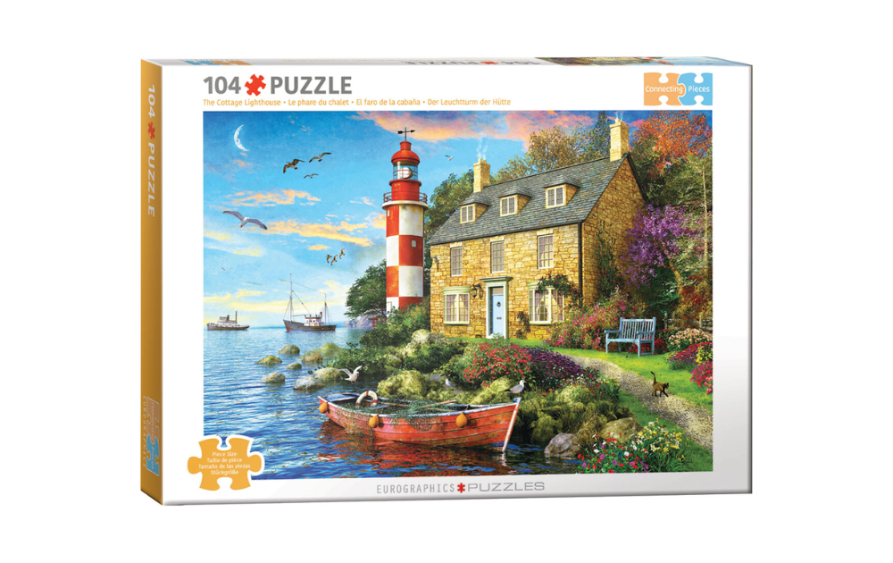 Eurographics cottage lighthouse jigsaw puzzle depicting stone seaside cottage with red white lighthouse and rowboat and garden