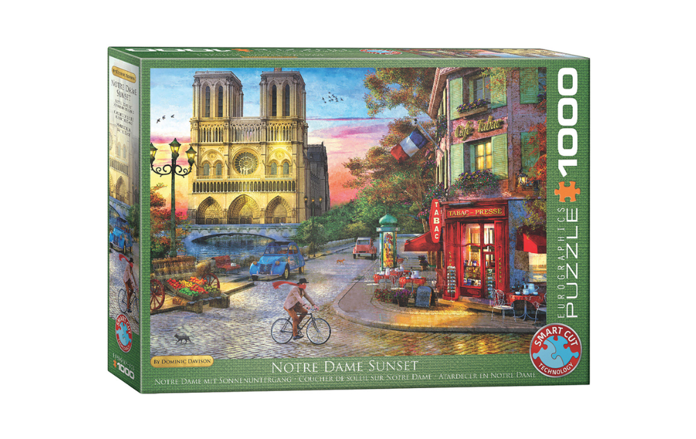 Eurographics 1000 piece Notre Dame sunset jigsaw puzzle box showing Notre Dame at sunset with riverside cafe and cyclist
