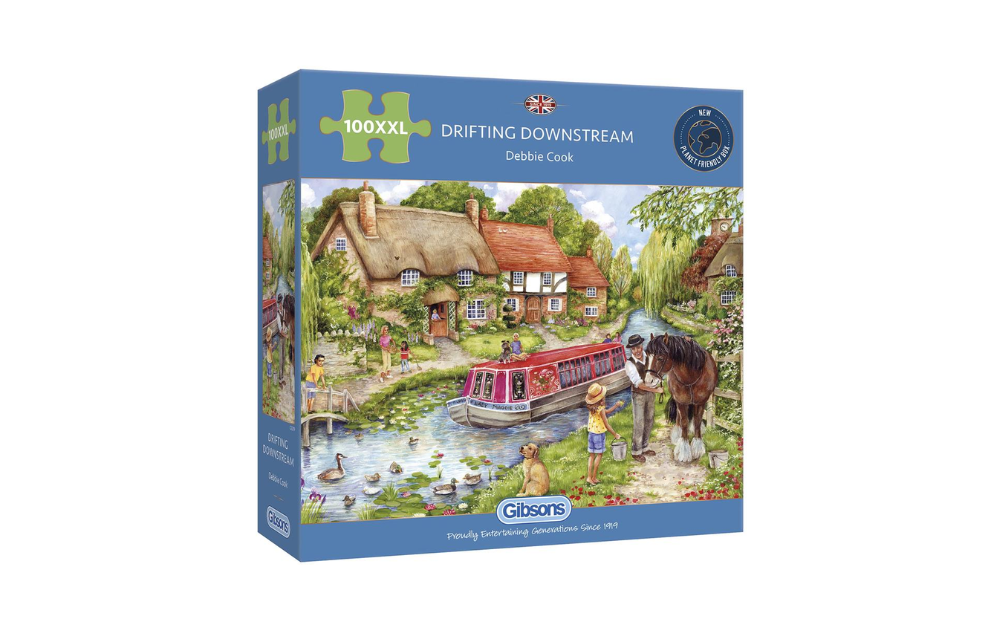 Gibsons Drifting Downstream puzzle with a scenic riverside village and colorful canal boat