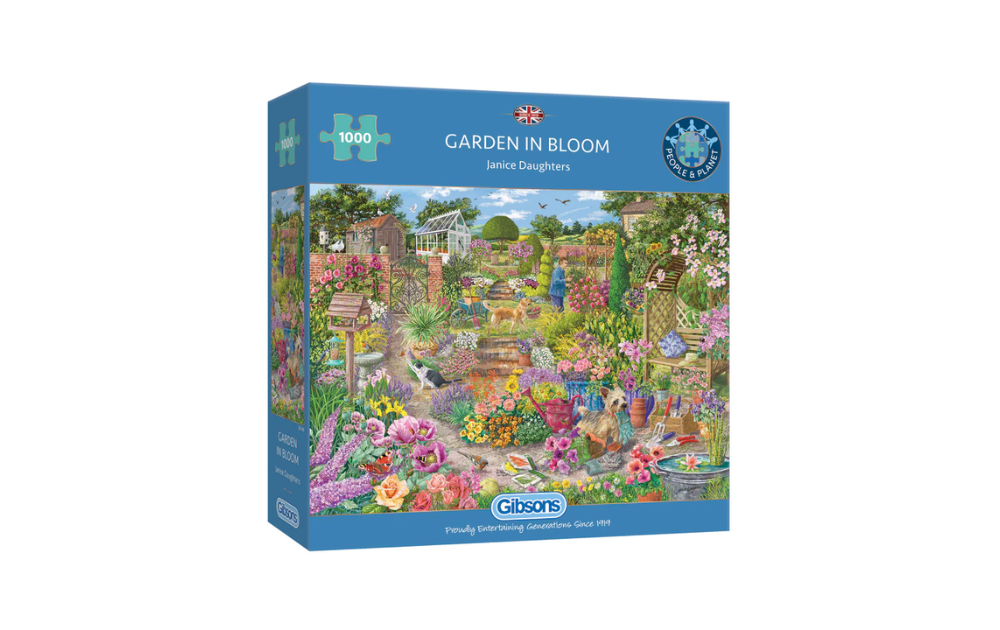 Gibsons garden in bloom jigsaw puzzle 1000 pieces box showing colourful cottage garden scene with pond