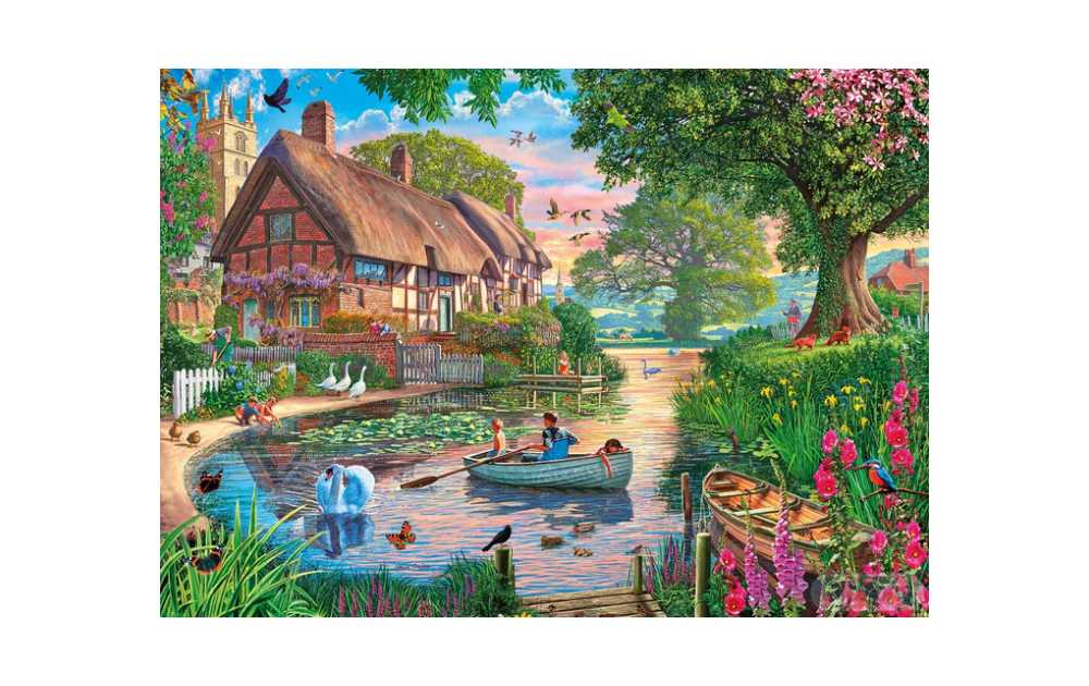 Gibsons Golden Hour puzzle depicting a serene countryside scene with cottages, a river, and wildlife