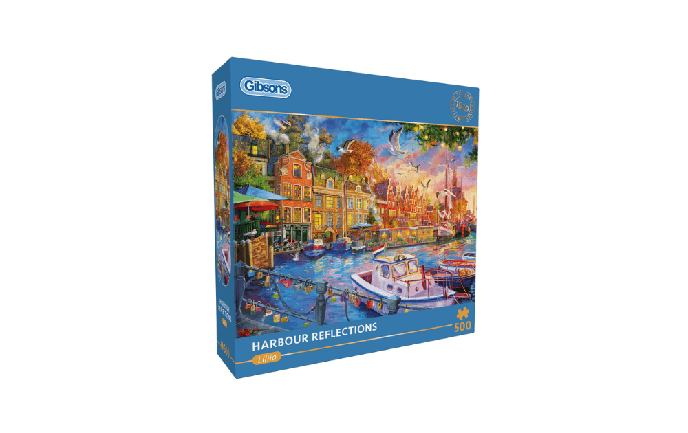 Gibsons Harbour Reflections 500 piece jigsaw puzzle featuring a vibrant harbour scene with boats and colourful buildings