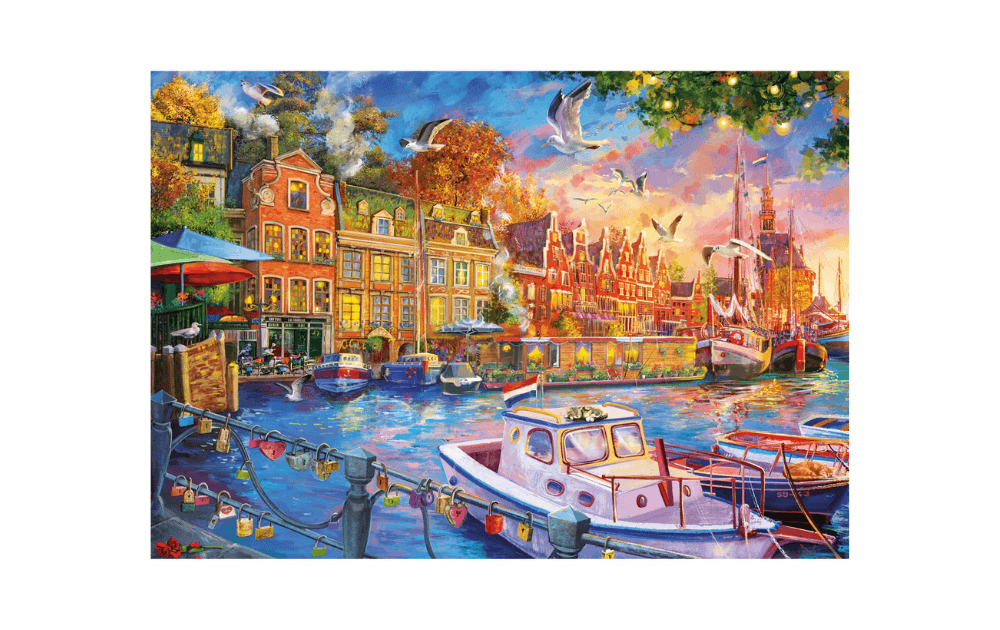 Gibsons Harbour Reflections 500 piece jigsaw puzzle featuring a vibrant waterfront scene with boats and charming buildings.