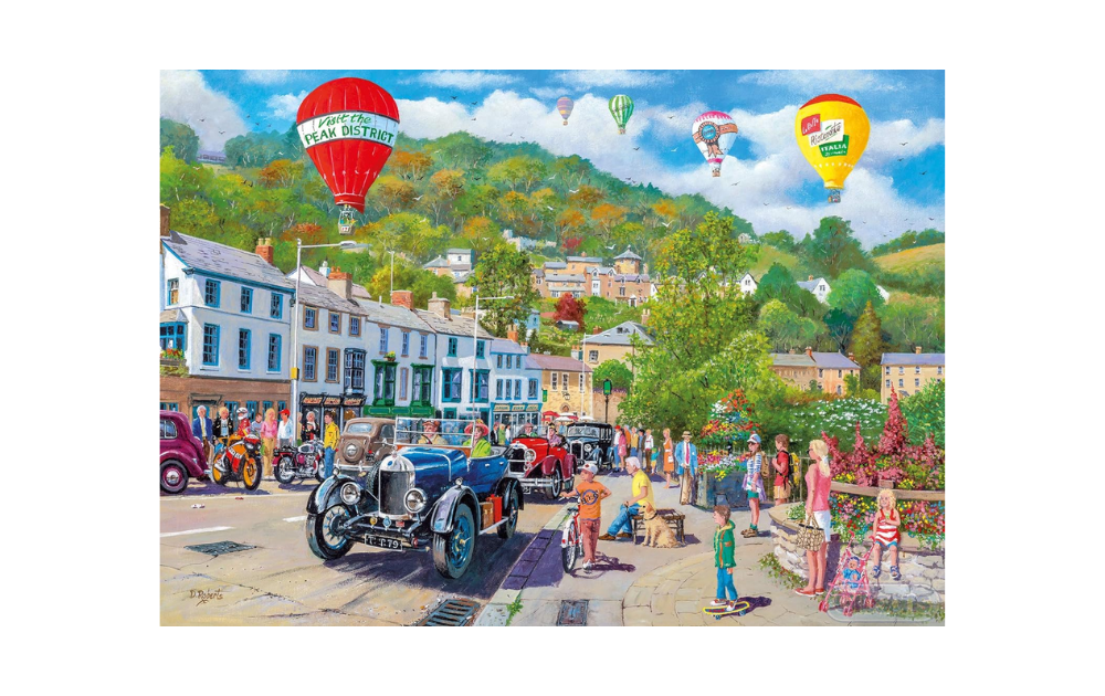 Gibsons Matlock Bath 500 piece puzzle featuring a colorful scene with vintage cars and hot air balloons