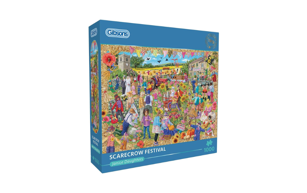 Gibsons Scarecrow Festival puzzle box featuring a vibrant countryside scene with people and decorations
