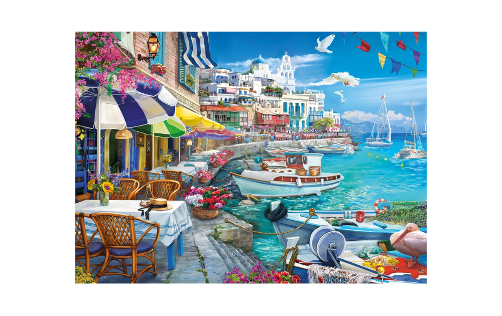 Sun Over the White Harbour 1000 Piece Jigsaw Puzzle by Gibsons depicting a vibrant seaside scene with boats and flowers