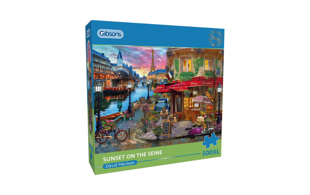 Gibsons Sunset on the Seine puzzle featuring a vibrant Parisian riverside scene with colorful cafes