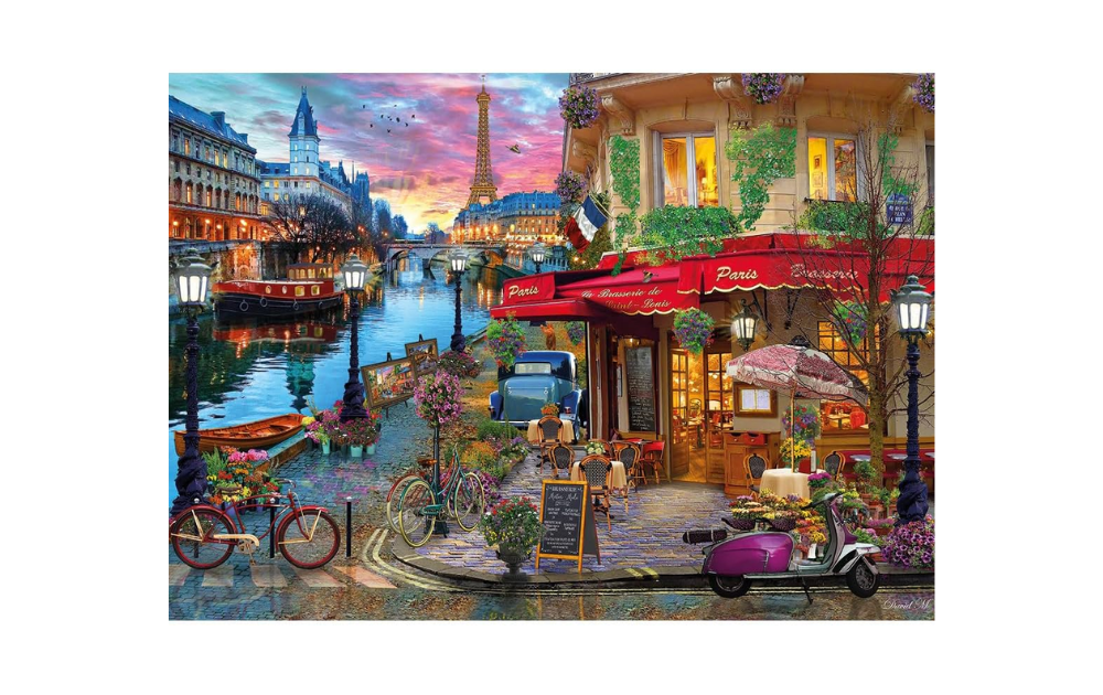 Gibsons Sunset on the Seine puzzle featuring a vibrant riverside café scene with Parisian landmarks