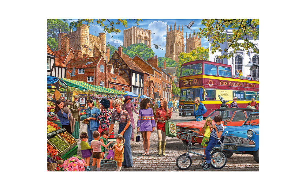 York market 1000 piece jigsaw puzzle depicting a busy cobbled market with stalls shoppers double decker bus and York Minster