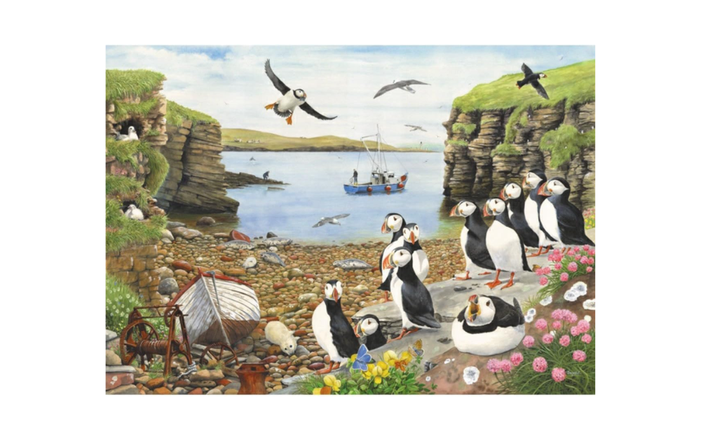 Puffin Parade 500 piece jigsaw featuring colorful puffins on a coastal scene with a boat in the background