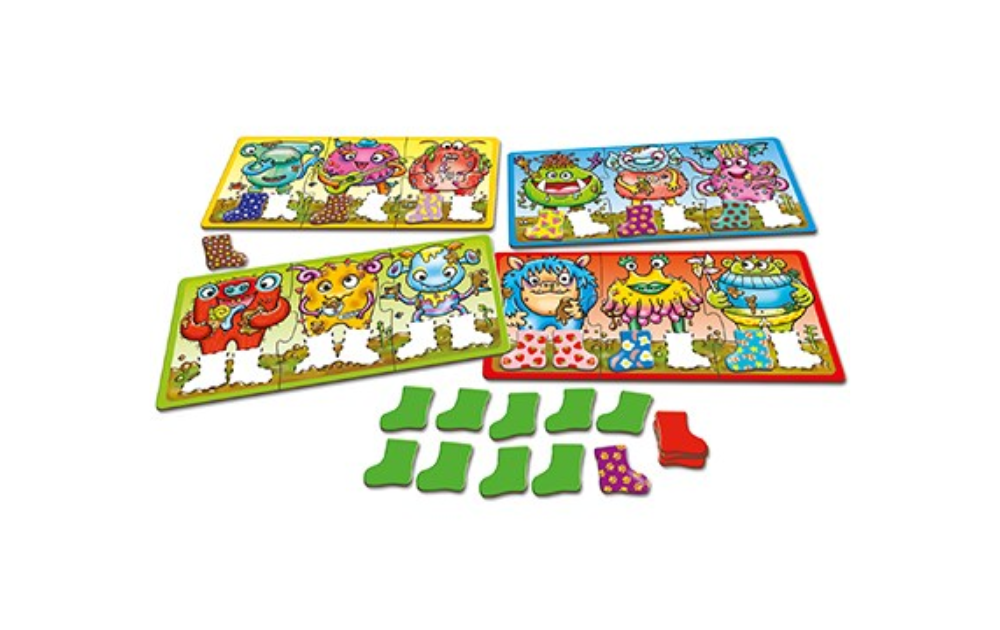 Orchard Toys Smelly Wellies game featuring colorful monster puzzles with matching tasks