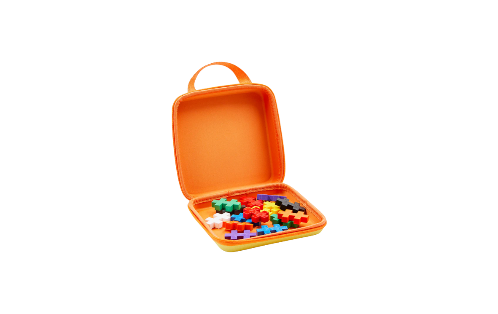Plus Plus BIG travel case in orange with colourful building pieces inside for on-the-go creativity