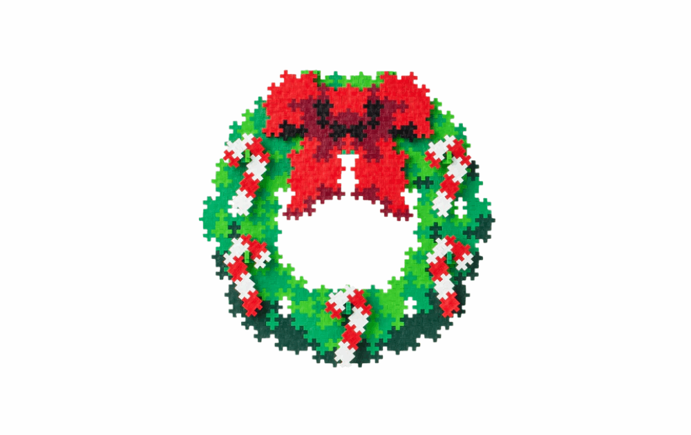 Colorful Plus Plus Christmas wreath puzzle by numbers featuring red bow and green foliage