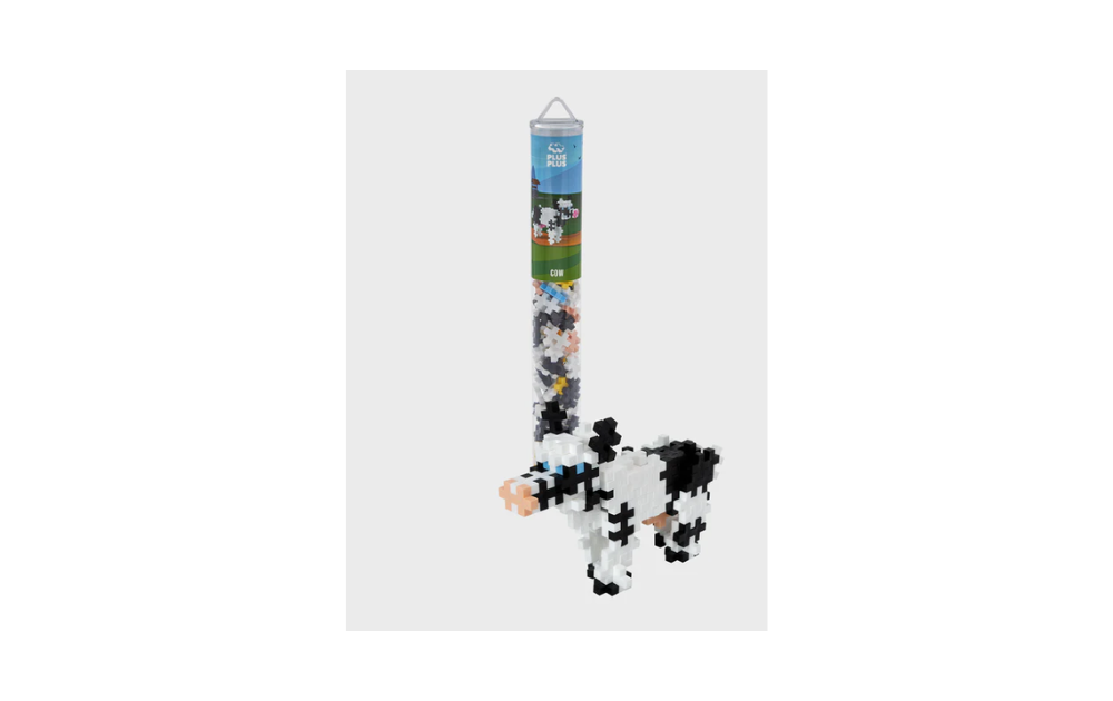 Plus Plus Cow puzzle in a 100 piece tube featuring colorful cow building blocks for creative play