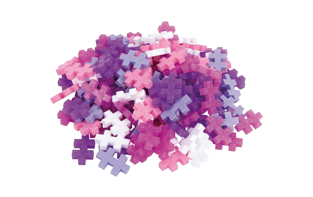Colorful Plus Plus glitter building blocks in various shades of purple and pink for creative play