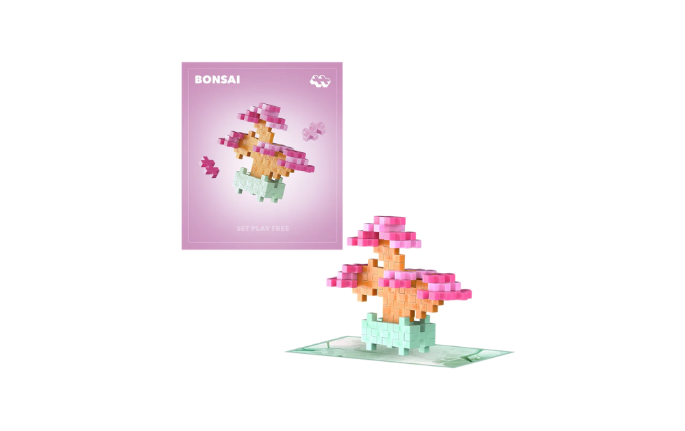 Plus Plus Pink Bonsai puzzle set featuring colorful building pieces for creative play