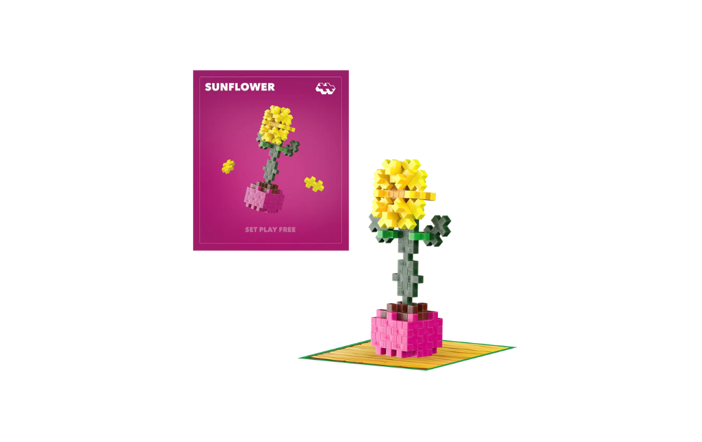 Plus Plus Sunflower puzzle kit featuring a bright sunflower in a pink pot with building instructions