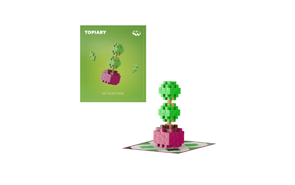 Plus Plus Topiary kit featuring a colorful tree model and instruction booklet for creative building fun