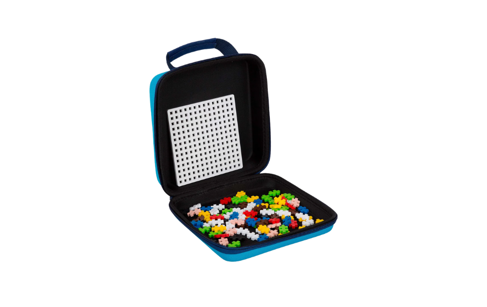 Plus Plus travel case in blue with colorful puzzle pieces and a white pegboard inside