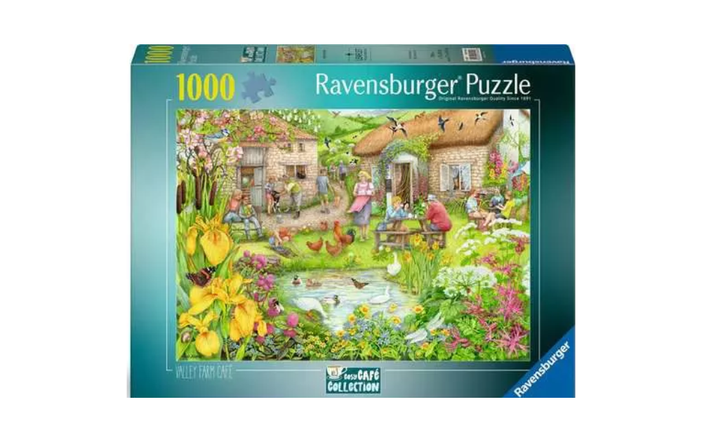 Ravensburger cosy cafe jigsaw puzzle with vibrant countryside scene featuring a garden, animals, and charming buildings
