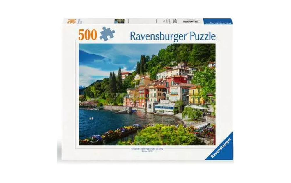 Ravensburger Lake Como puzzle featuring a scenic view of colorful buildings by the lake in a serene landscape