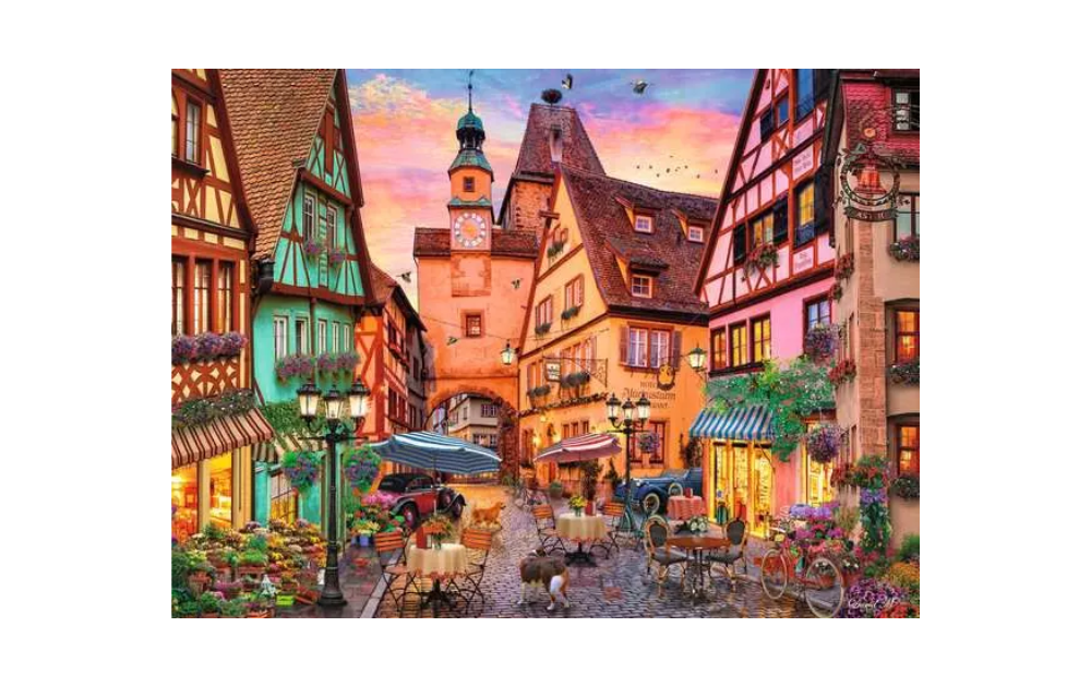 Ravensburger Bavarian Romance puzzle featuring a charming street scene with colorful buildings and a sunset