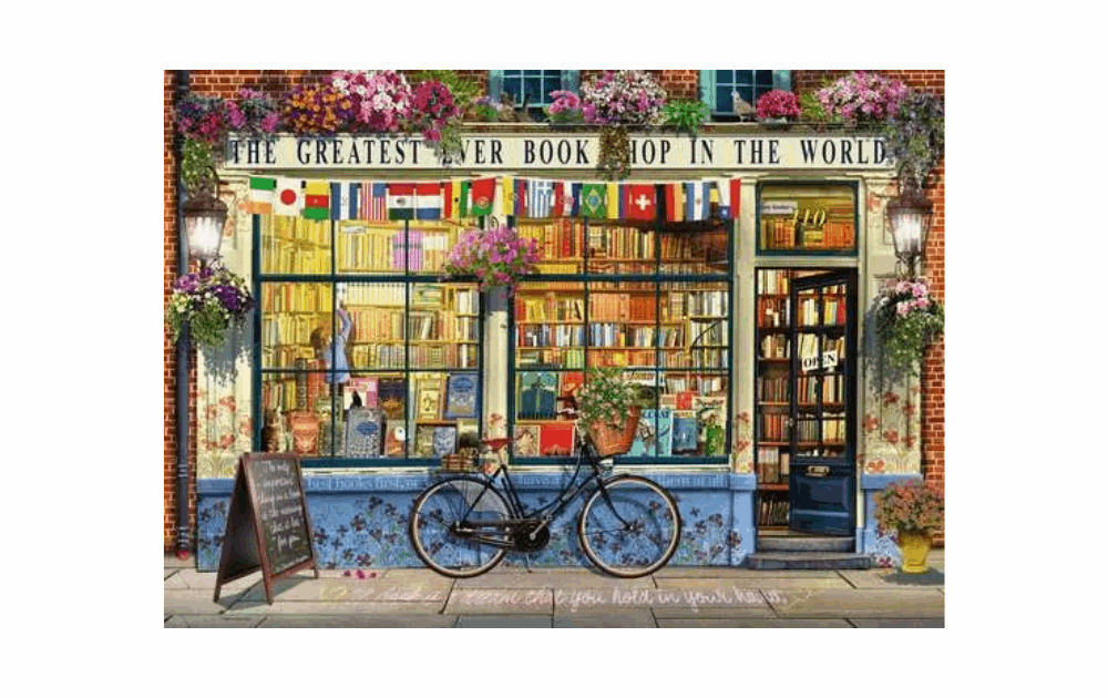Ravensburger The Greatest Bookshop puzzle showcasing a charming bookstore facade with flags and a bicycle