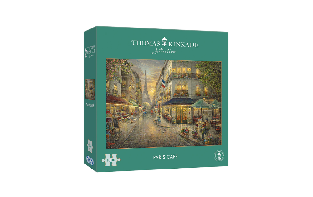 Gibsons Thomas Kinkade Paris Cafe puzzle box featuring a charming Parisian street scene