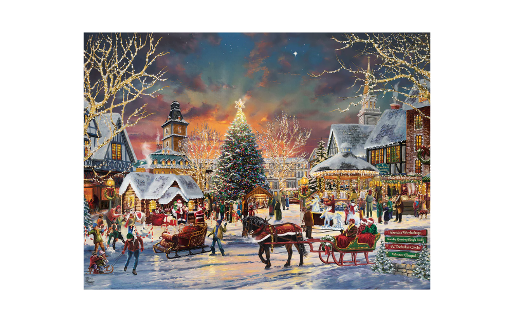 Gibsons Thomas Kinkade Christmas puzzle showing snowy village square with illuminated tree and horse drawn sleighs and carolers