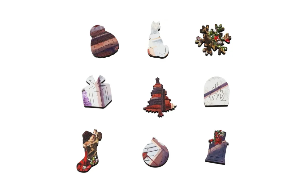 Close-up of Wentworth Christmas cabin puzzle 250 pieces featuring unique wooden puzzle pieces