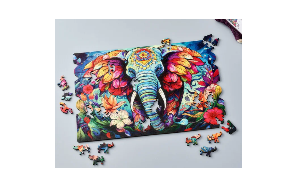 Wentworth Flowering Elephant puzzle showing colourful elephant design with floral patterns and scattered pieces