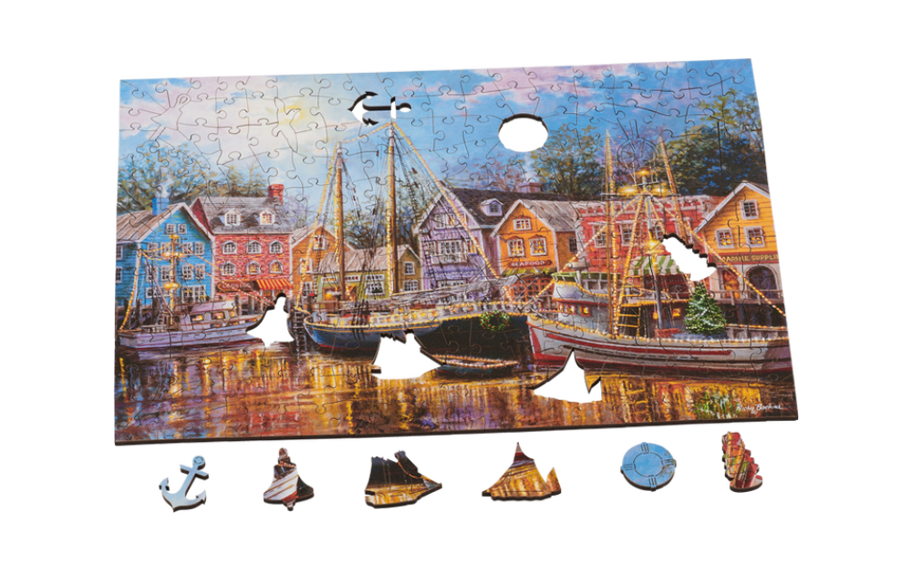 Wentworth Ships Aglow puzzle partially assembled showing colourful harbour scene with boats and unique shaped pieces