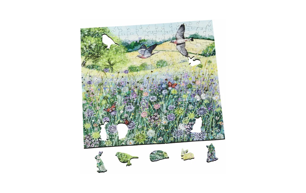 Wentworth summer jigsaw puzzle featuring a colourful meadow with birds and flowers and unique character-shaped pieces