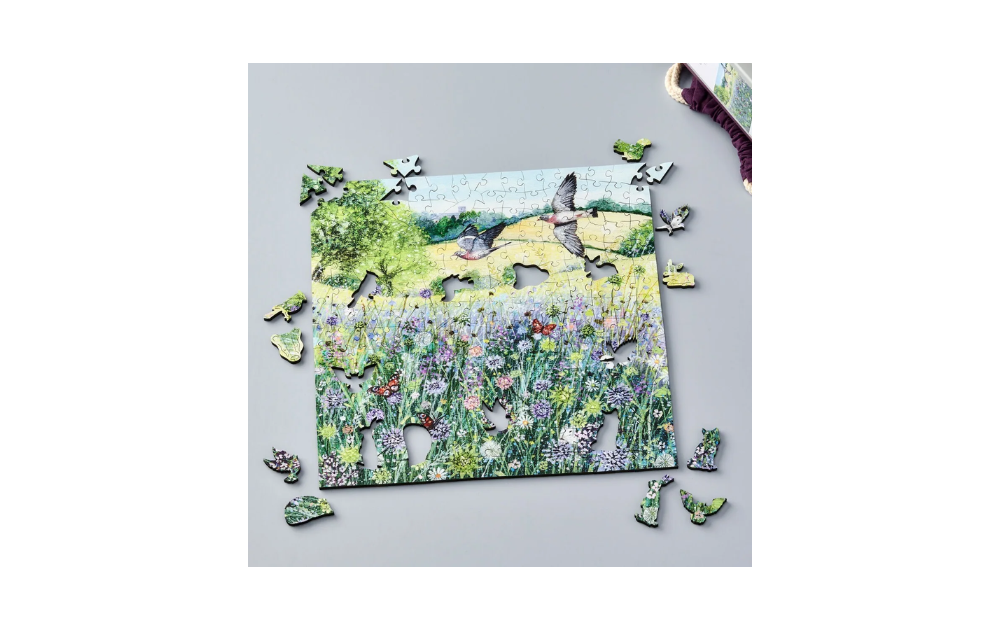 Wentworth summer landscape puzzle showing birds flying over a wildflower meadow with countryside background