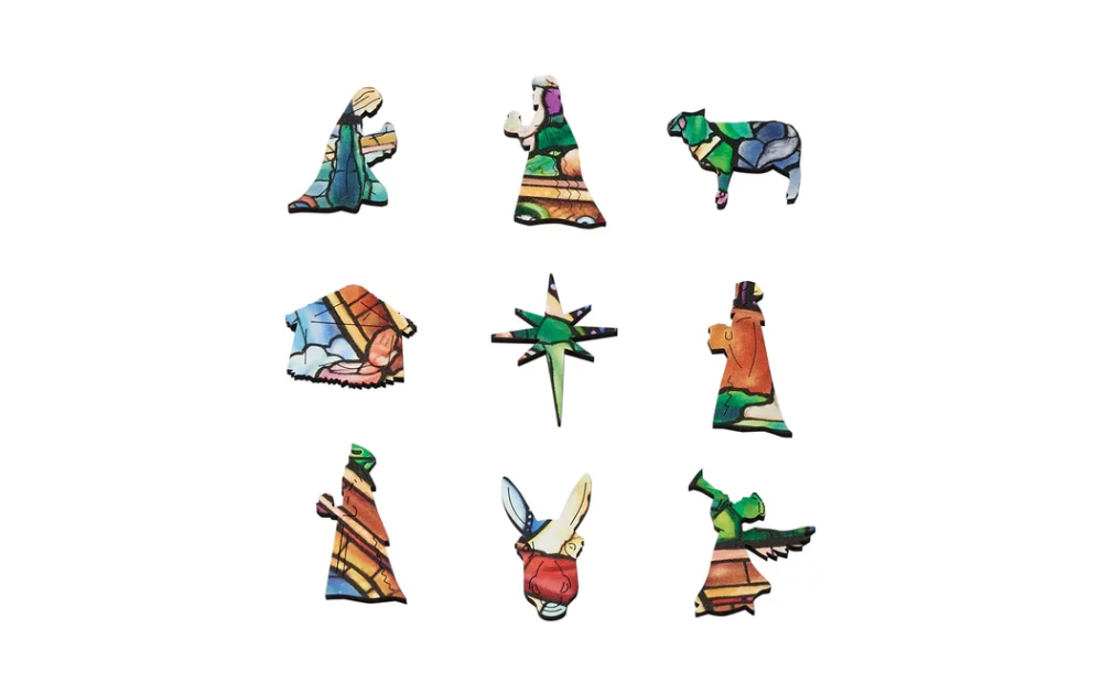 Colourful Wentworth wooden Christmas puzzle pieces featuring festive characters and designs
