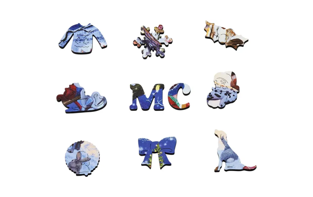 Wentworth wooden Christmas jigsaw puzzle pieces featuring various festive shapes and designs