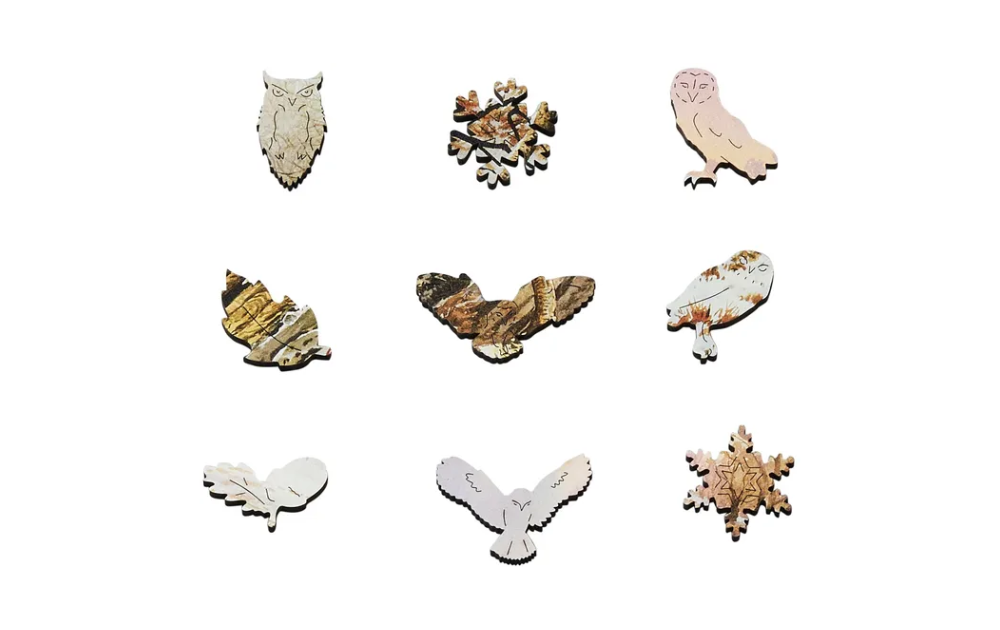 Wentworth wooden tawny owl jigsaw puzzle pieces featuring intricate owl and leaf shapes